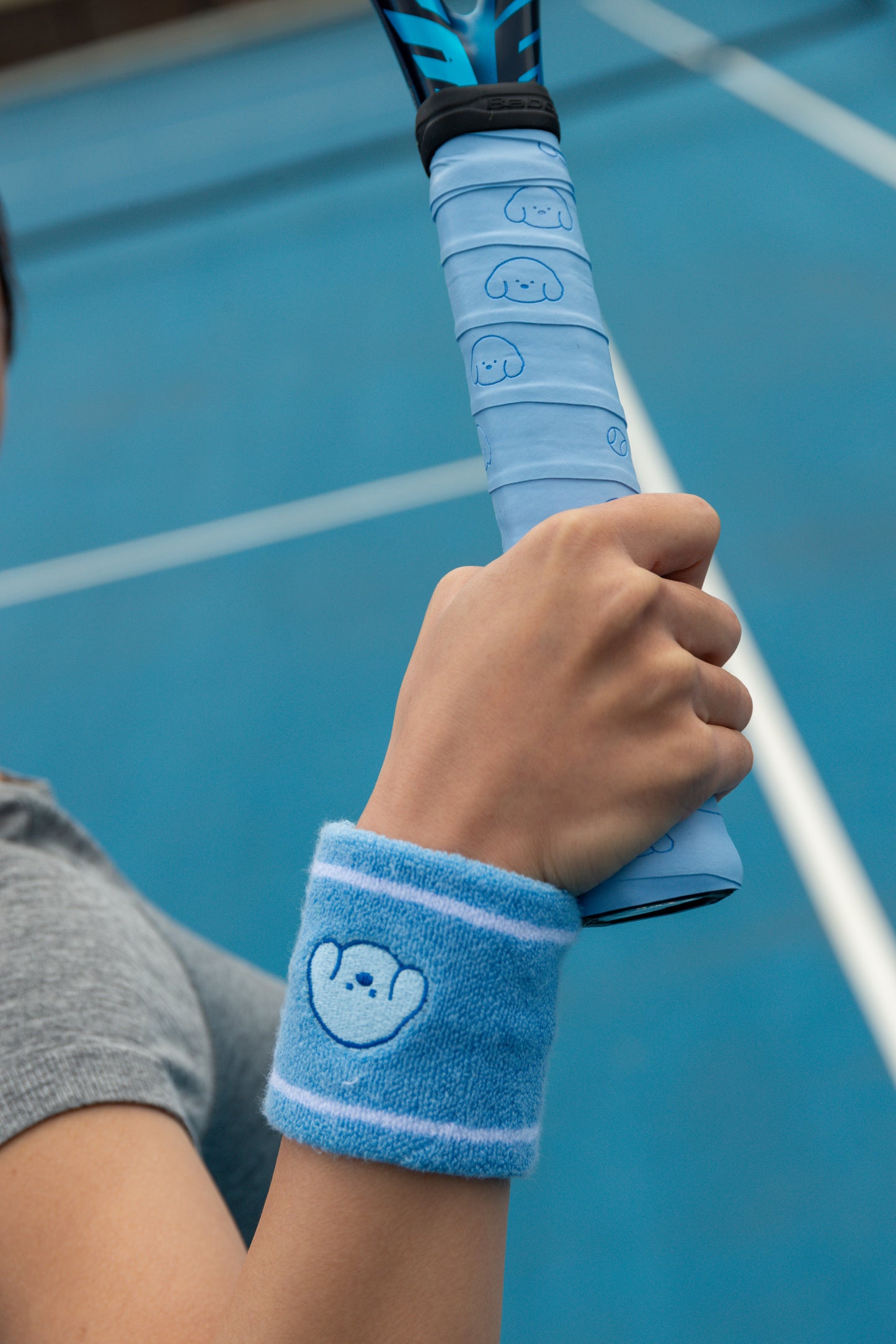 pwp-pdp-add-2026-08-02 tennis-wristband-bright B253 — The Pupcourt golden retriever wristband worn on court